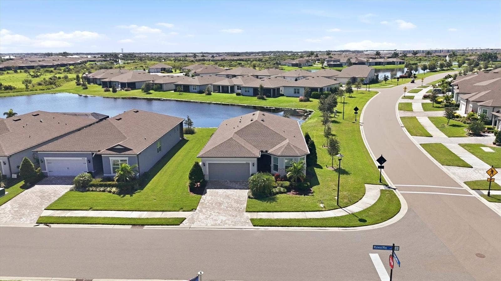 10635 WYNWARD WAY, Parrish, FL 34219 Close to the clubhouse with a pond view!