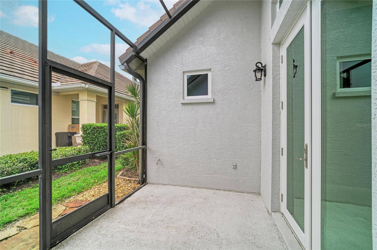 7816 HERITAGE CLASSIC COURT, Lakewood Ranch, FL 34202 Patio off Kitchen & Dining Room