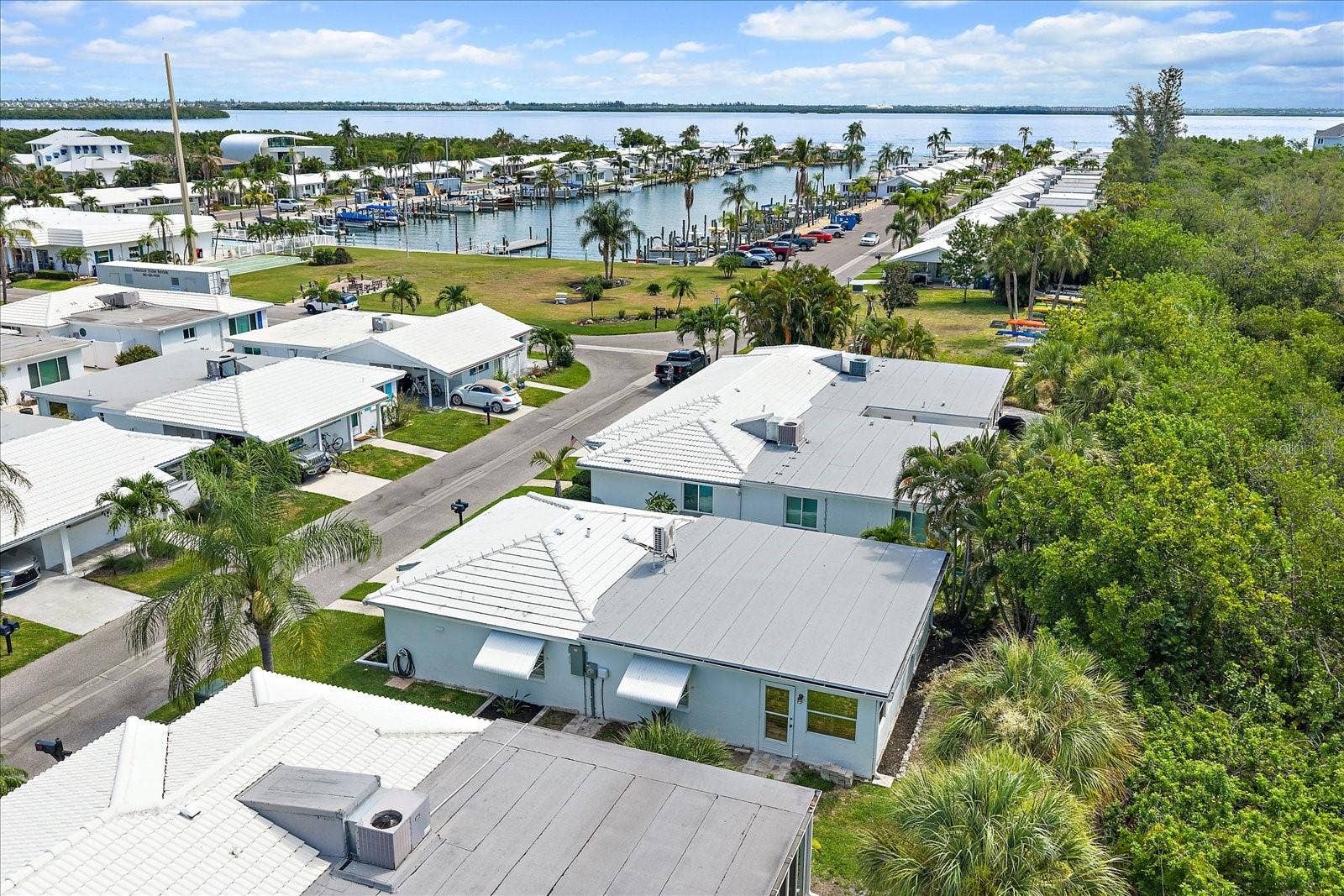 Aerial view of condo complex with carports