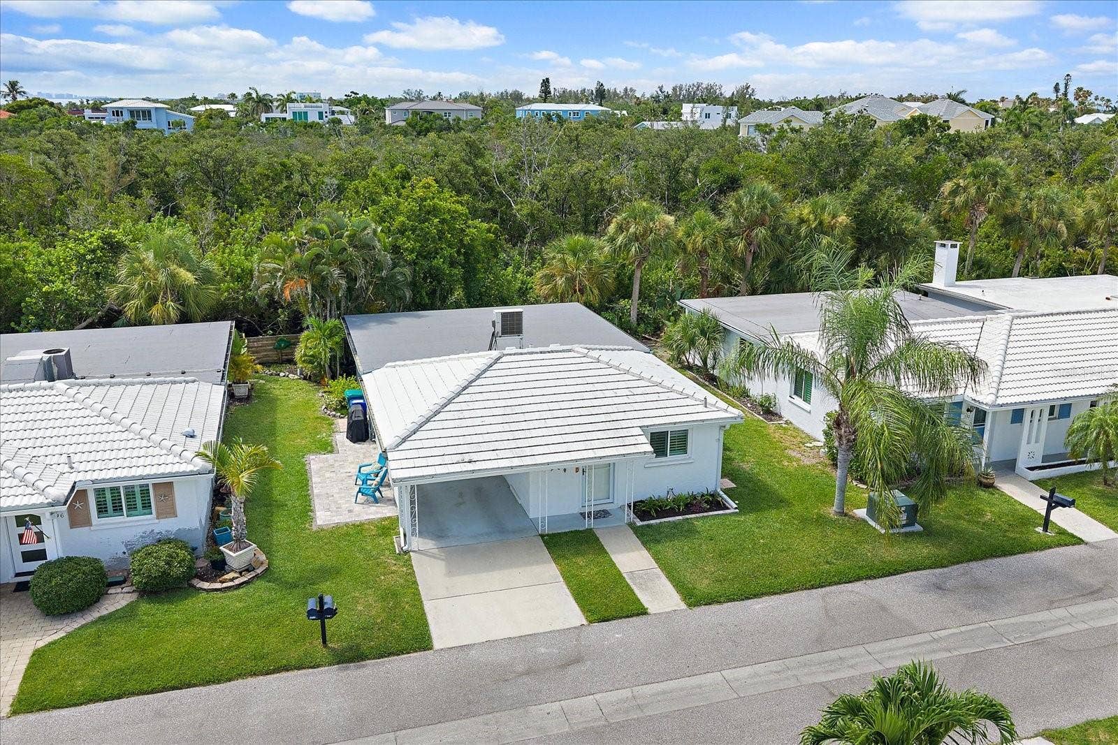 Aerial view of free standing condo with rear privacy