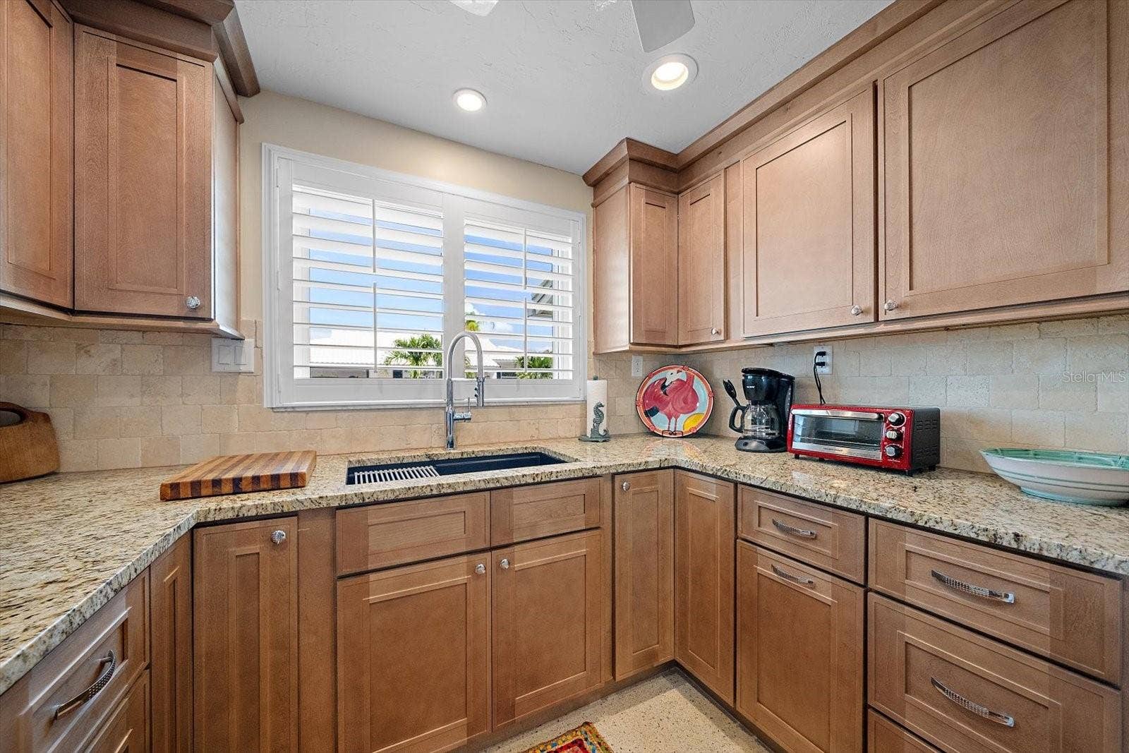 Kitchen with sink and wood cabinetry