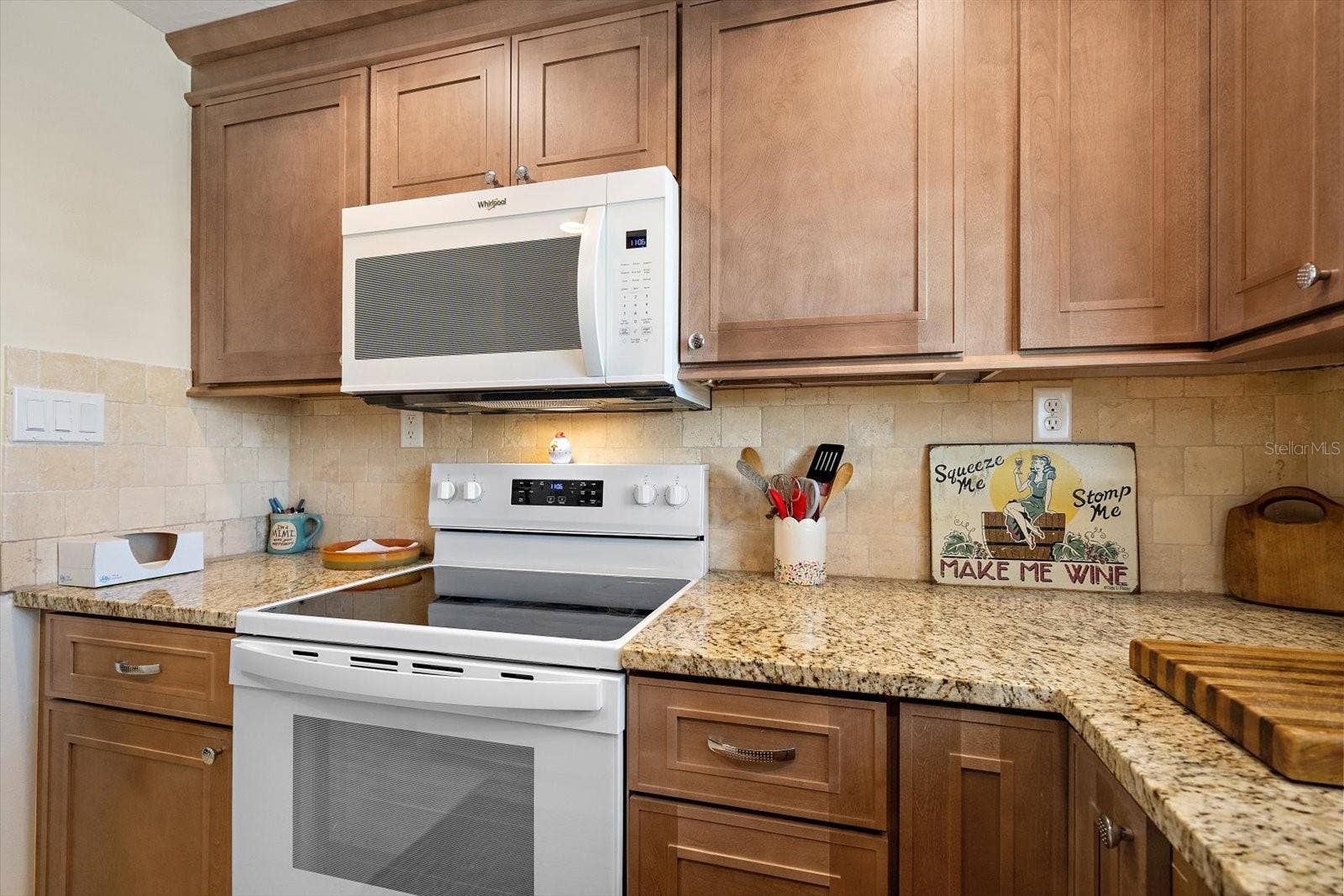 Kitchen with range and microwave