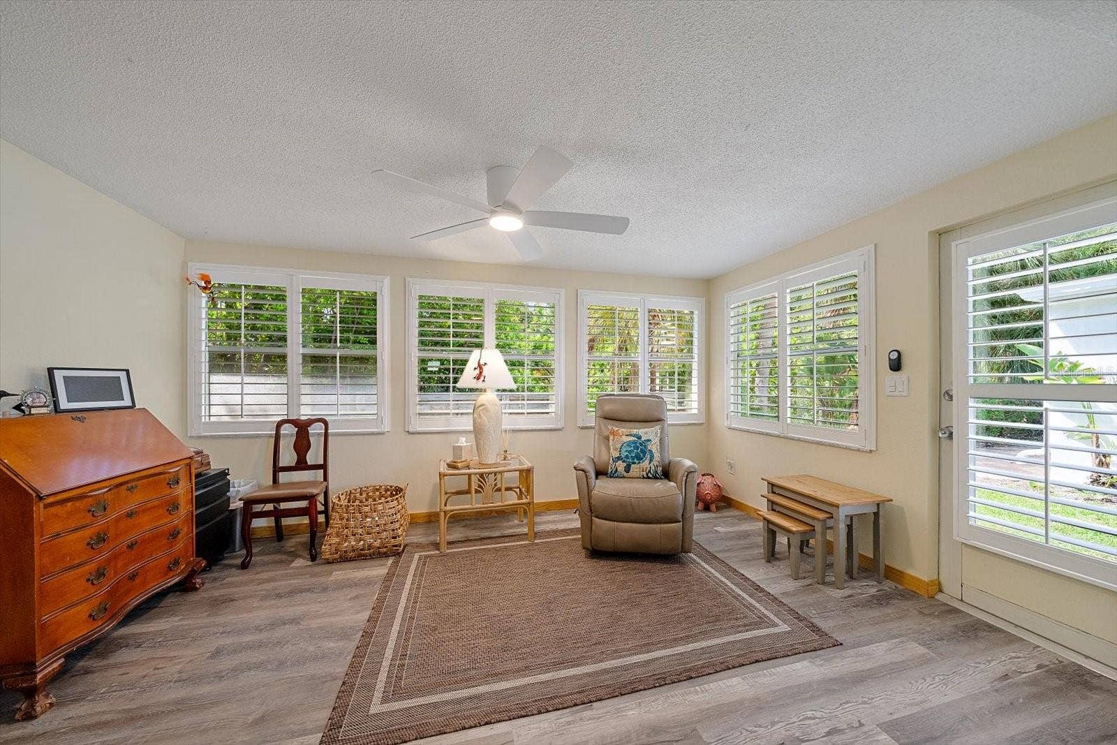 Florida room / sitting area with wicker furniture