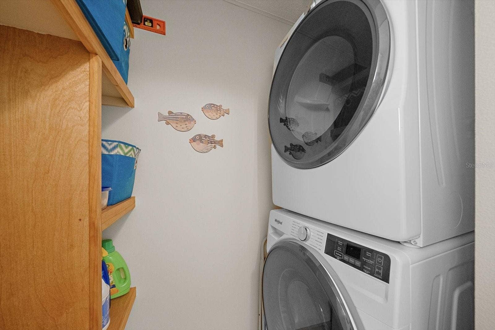 Laundry closet with stacked washer and dryer