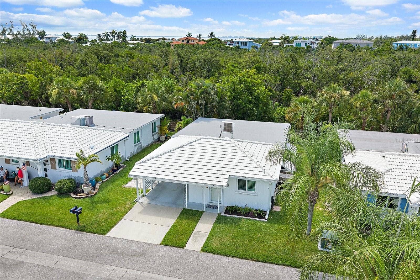 Aerial view of free standing condo with rear privacy