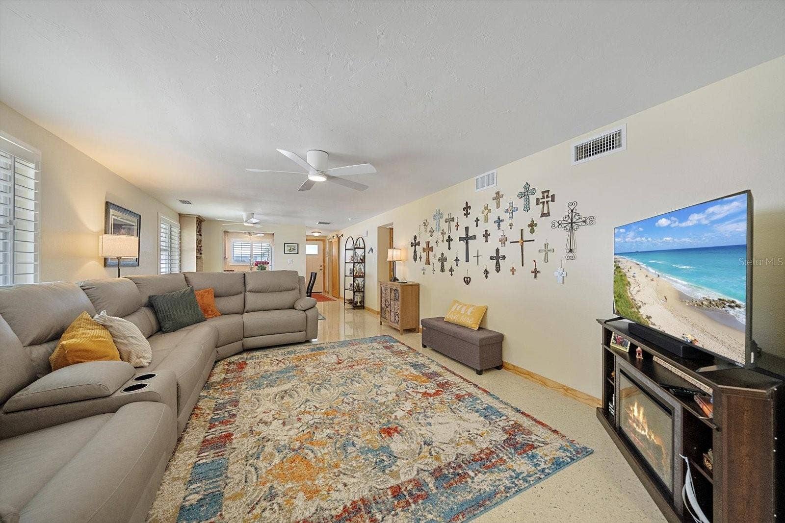 Living room with sectional seating and TV
