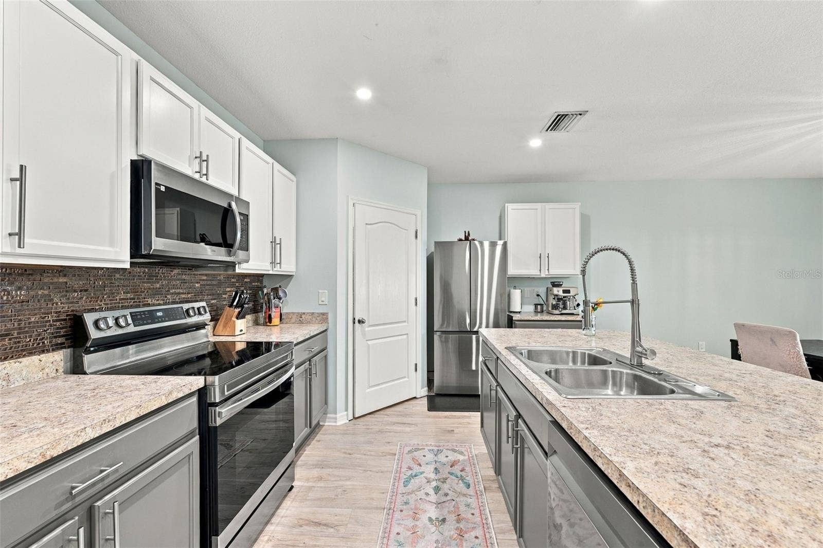 5213 11TH STREET E, Bradenton, FL 34203 Kitchen with brand new appliances and walk-in pantry
