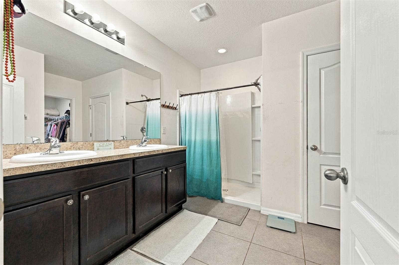 5213 11TH STREET E, Bradenton, FL 34203 Primary bathroom with shower and 2-closets