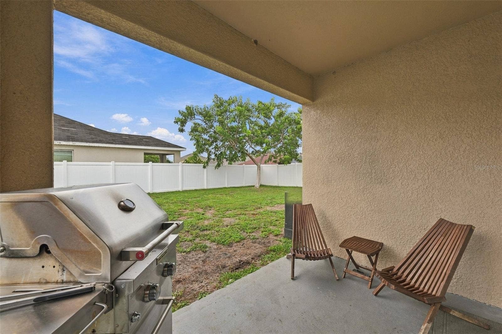 5213 11TH STREET E, Bradenton, FL 34203 Covered lanai area with access from dining area sliding doors