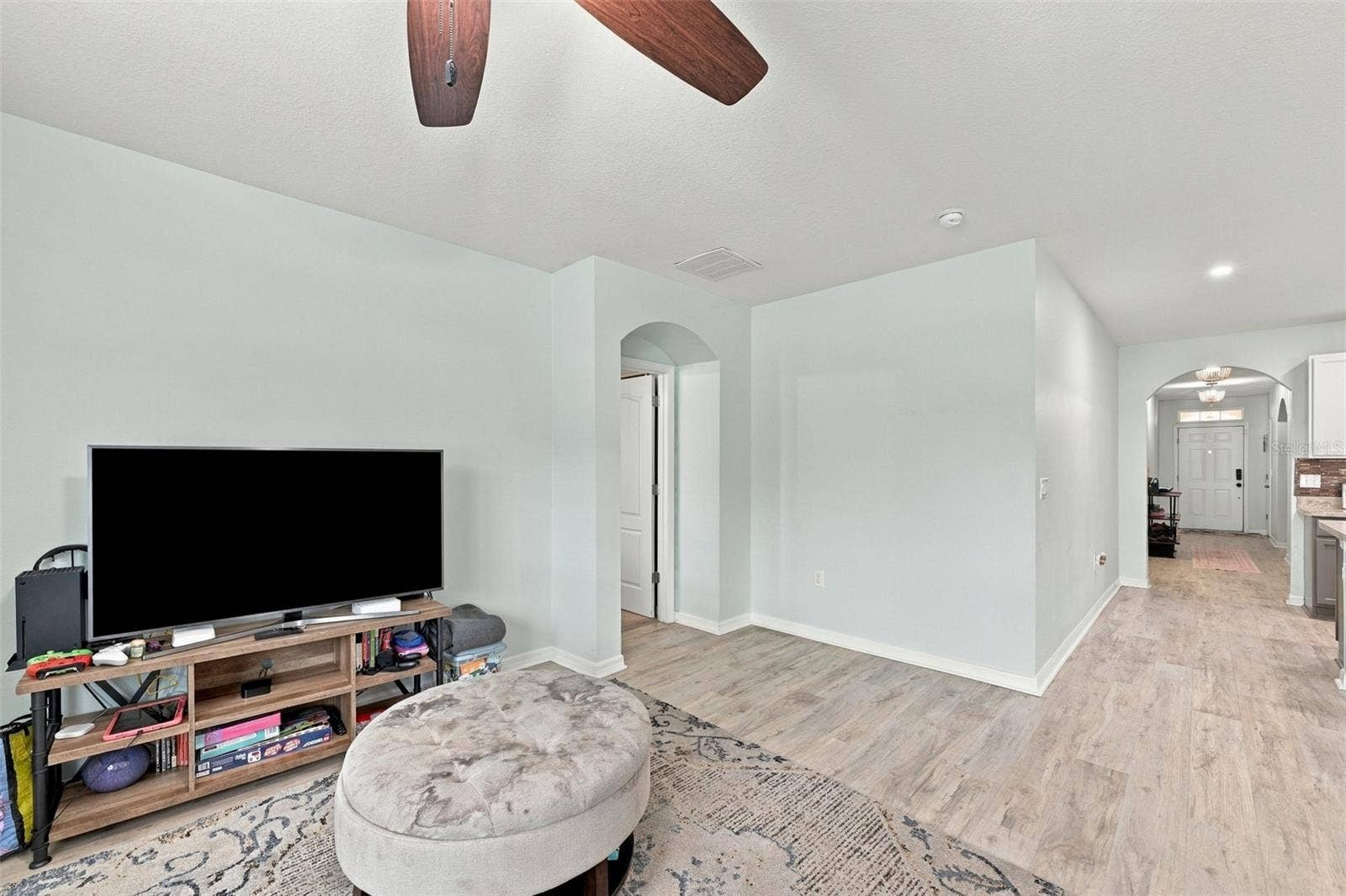 5213 11TH STREET E, Bradenton, FL 34203 Living room/hallway to 3 guest bedrooms and laundry