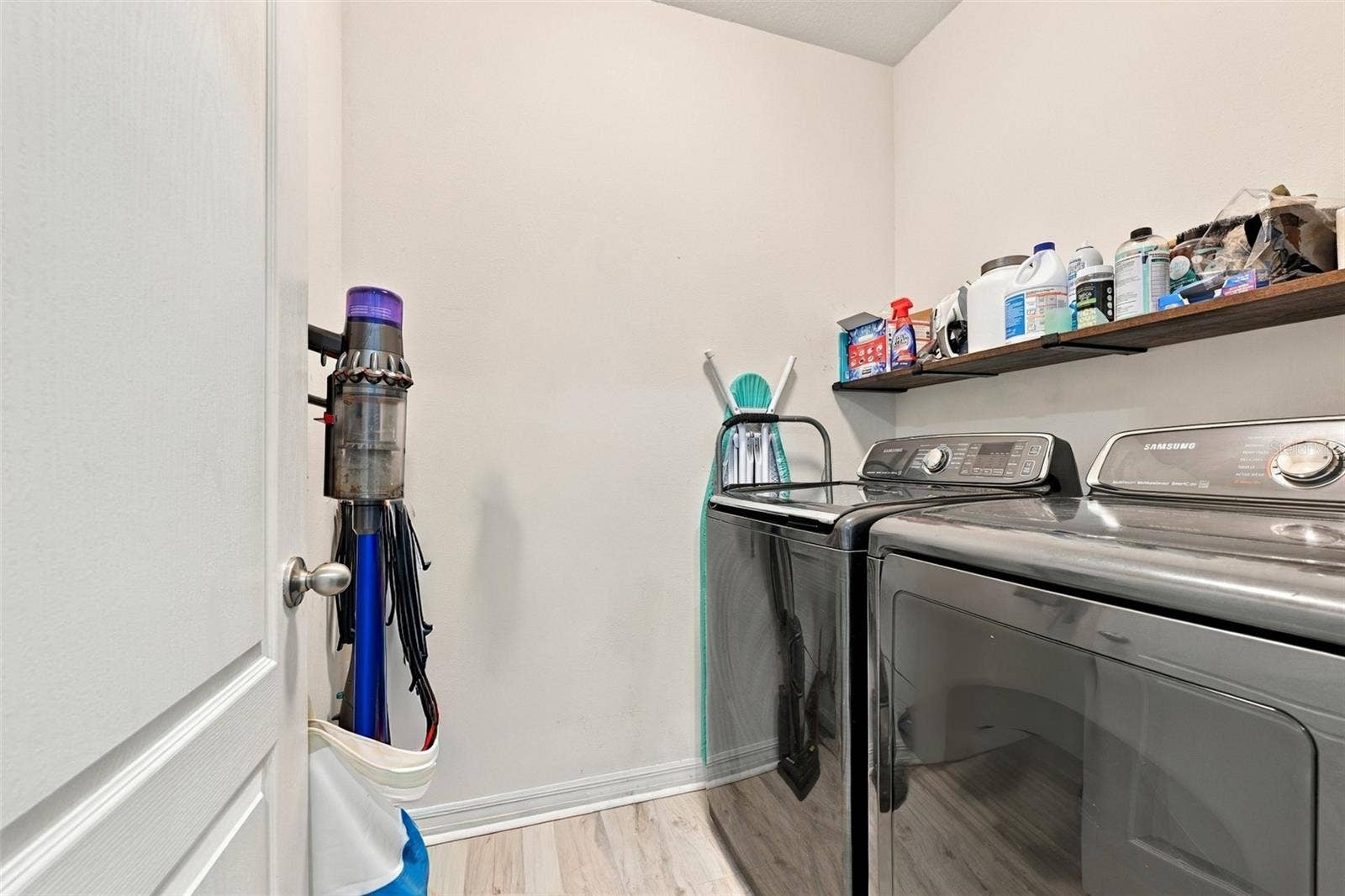 5213 11TH STREET E, Bradenton, FL 34203 Laundry room located near 3 guest bedrooms