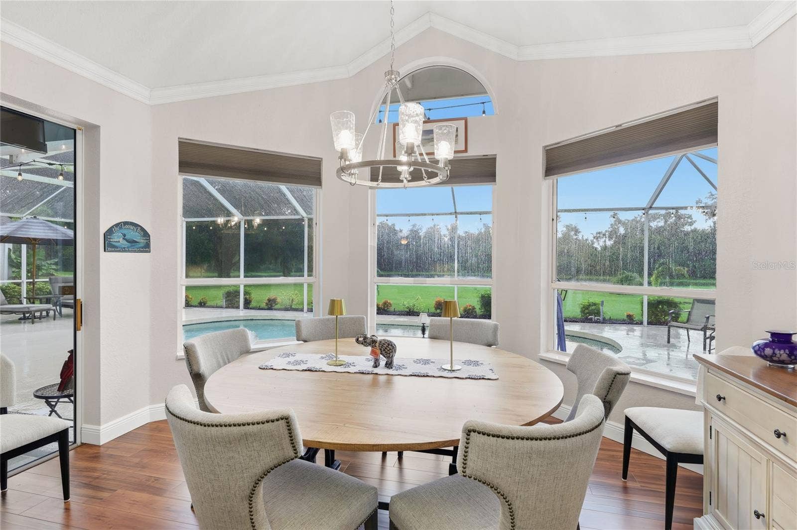 3306 LITTLE COUNTRY ROAD, Parrish, FL 34219 Florida dining room poolside with a lake view