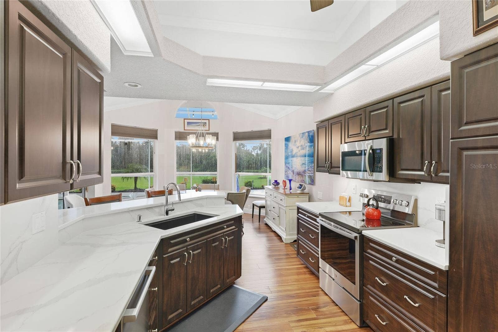 3306 LITTLE COUNTRY ROAD, Parrish, FL 34219 Updated kitchen appliances include a Bosch Benchmark dishwasher, GE profile range, and Bosch refrigerator.