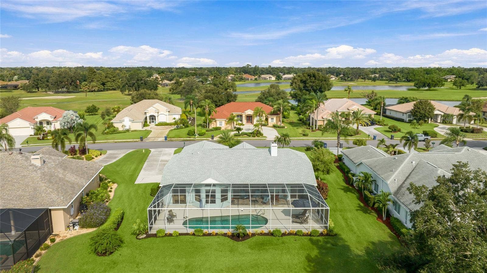 3306 LITTLE COUNTRY ROAD, Parrish, FL 34219 Screened in pool and lanai with lake views!