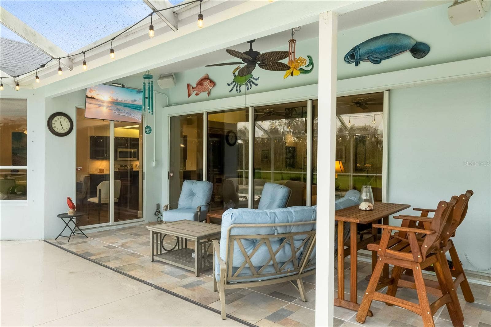 3306 LITTLE COUNTRY ROAD, Parrish, FL 34219 Entertain on the patio or watch the game on the wall mounted TV