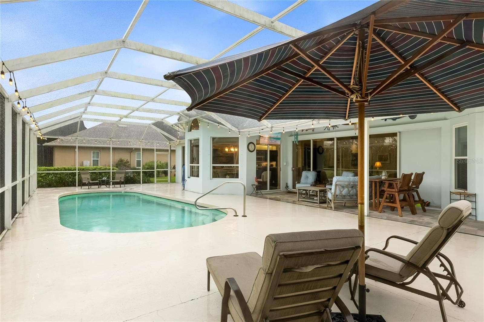 3306 LITTLE COUNTRY ROAD, Parrish, FL 34219 Lounge on your poolside lanai while enjoying the lakeside view