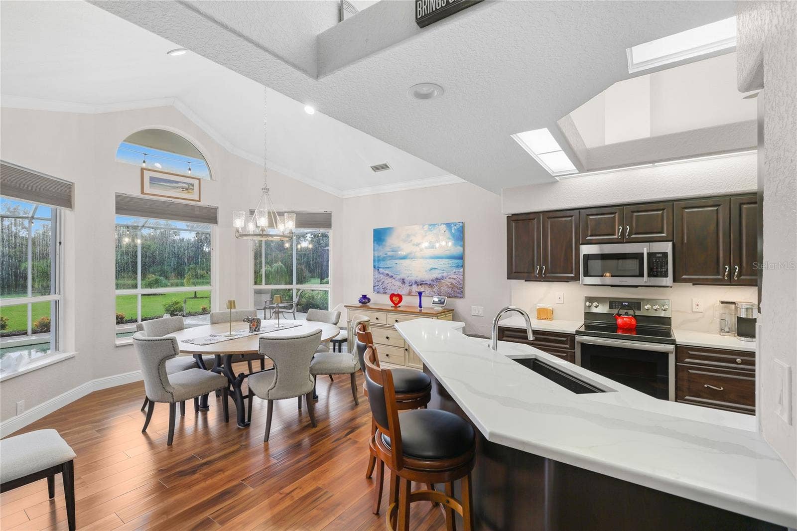 3306 LITTLE COUNTRY ROAD, Parrish, FL 34219 Enjoy mealtime at the built-in breakfast bar and designated dining area with a private lake view!