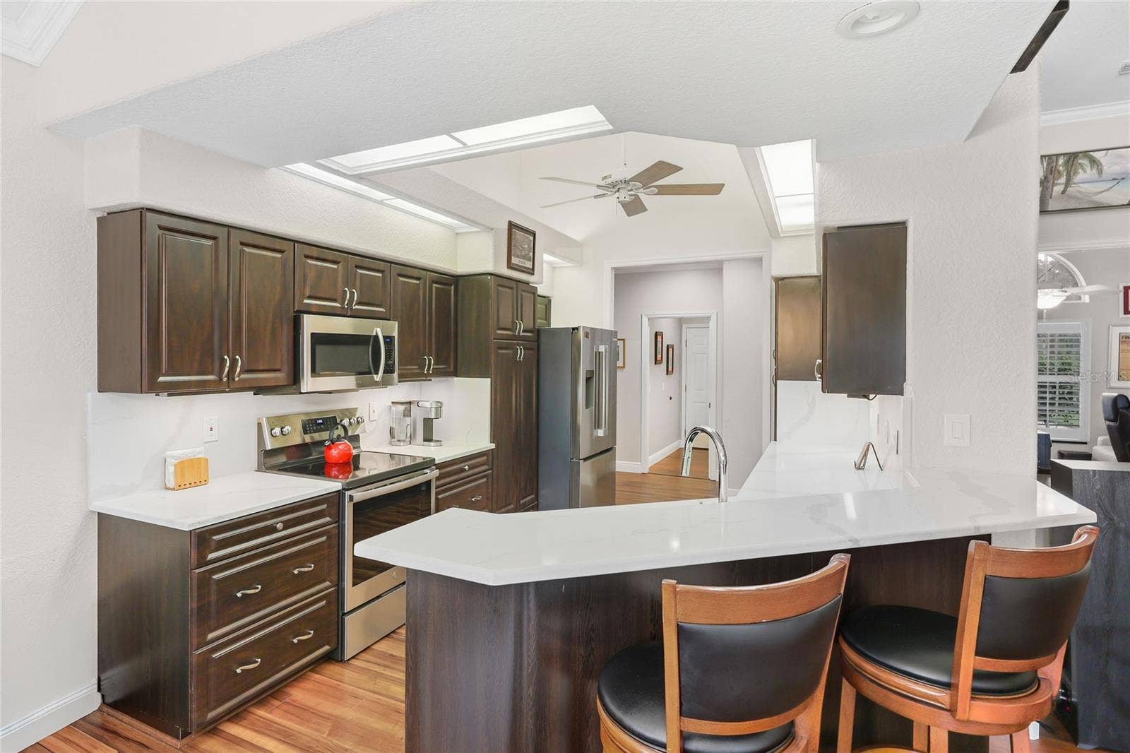 3306 LITTLE COUNTRY ROAD, Parrish, FL 34219 The updated kitchen sparkles with new quartz countertops and backsplash,