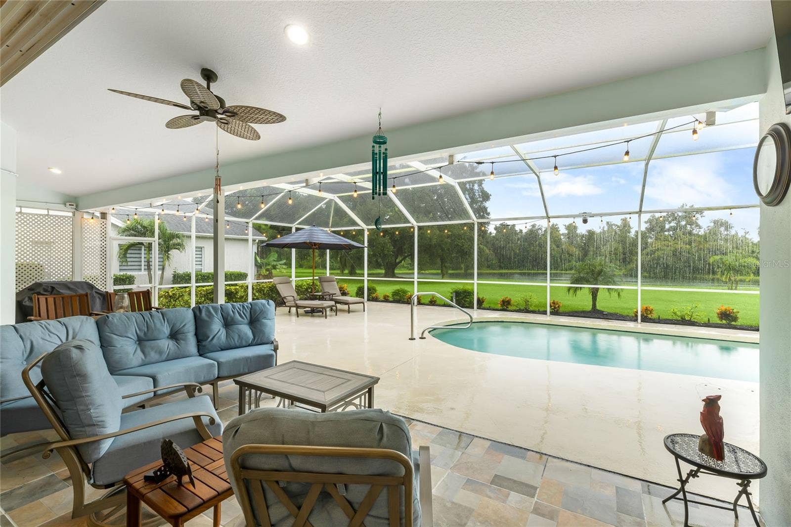 3306 LITTLE COUNTRY ROAD, Parrish, FL 34219 Covered lanai with completely screened in-ground pool