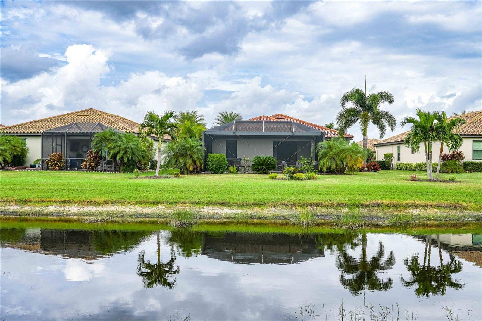7124 MARSH VIEW TERRACE STREET, Bradenton, FL 34212 Back of house facing north from accross the pond