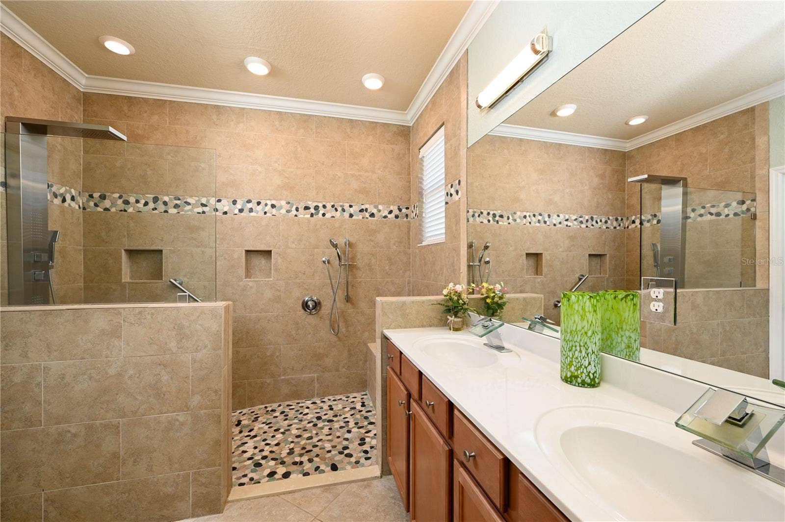 7124 MARSH VIEW TERRACE STREET, Bradenton, FL 34212 Primary ensuite bath with shower tower and seated bathing