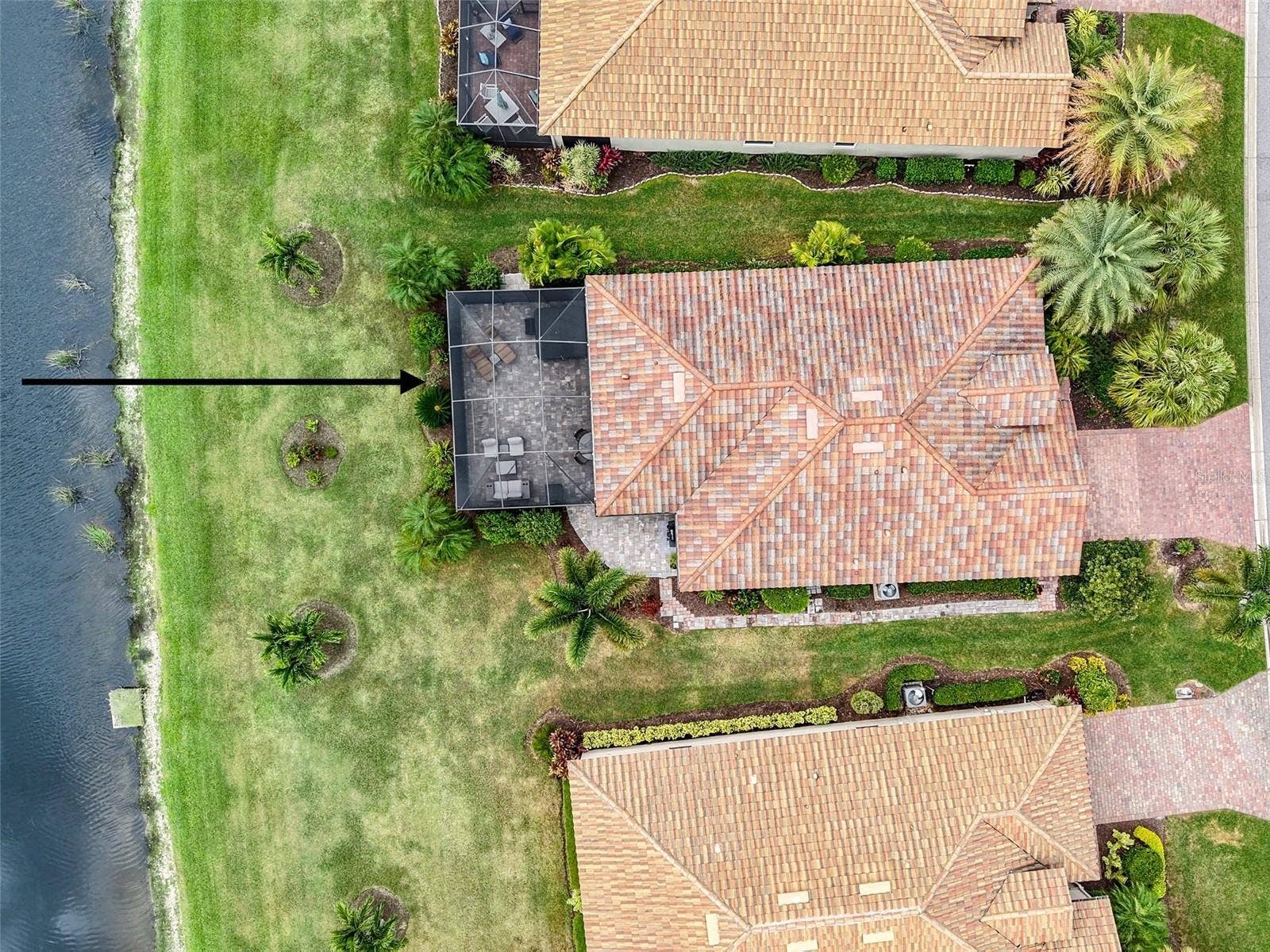 7124 MARSH VIEW TERRACE STREET, Bradenton, FL 34212 Aerial view of house facing west, pond on left