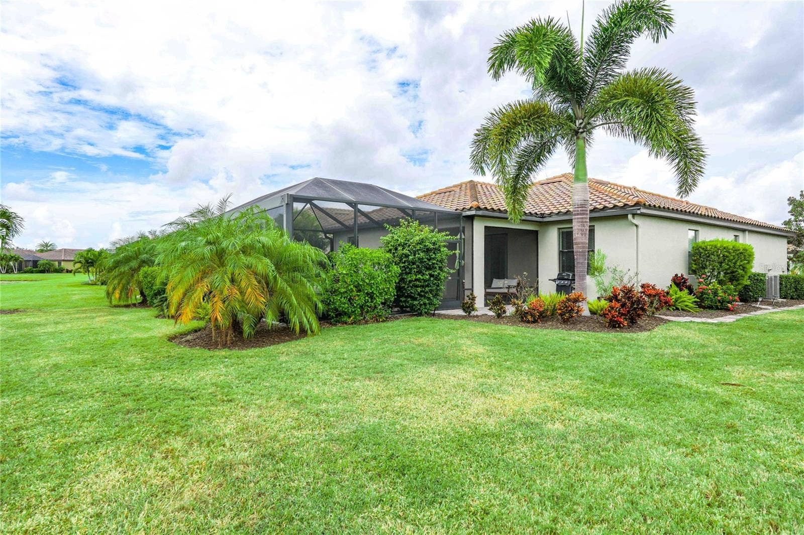 7124 MARSH VIEW TERRACE STREET, Bradenton, FL 34212 Yard and back of house facing northwest