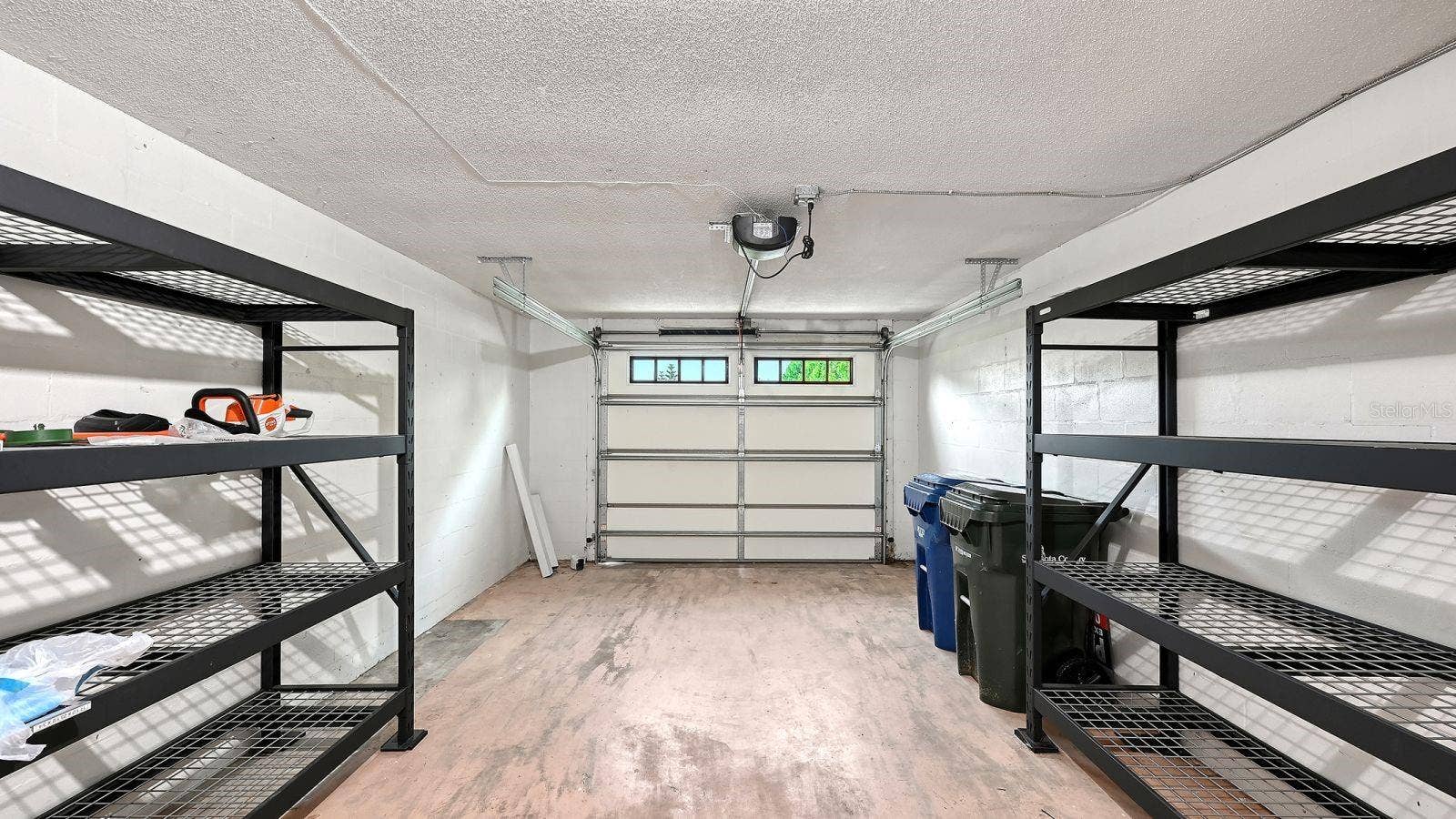 Spacious, One Car Garage with a Hurricane Garage Door & Storage Racks