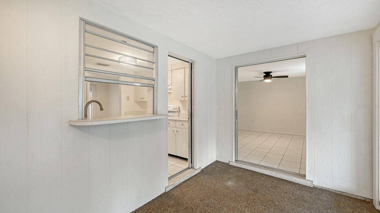 Pass thru window and door from the Kitchen to the Florida Room