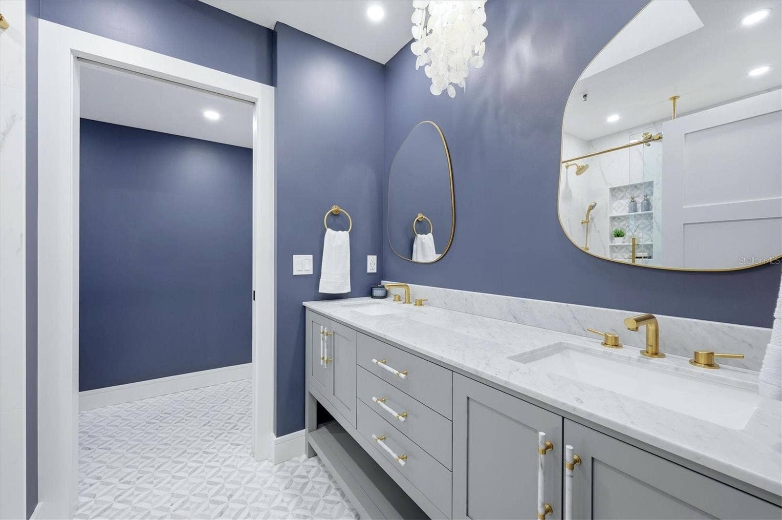 2141 HARBOURSIDE DRIVE, #1203, Longboat Key, FL 34228 Primary Bathroom with Double Sinks and Carerra Marble vanity top, water closet with linen storage