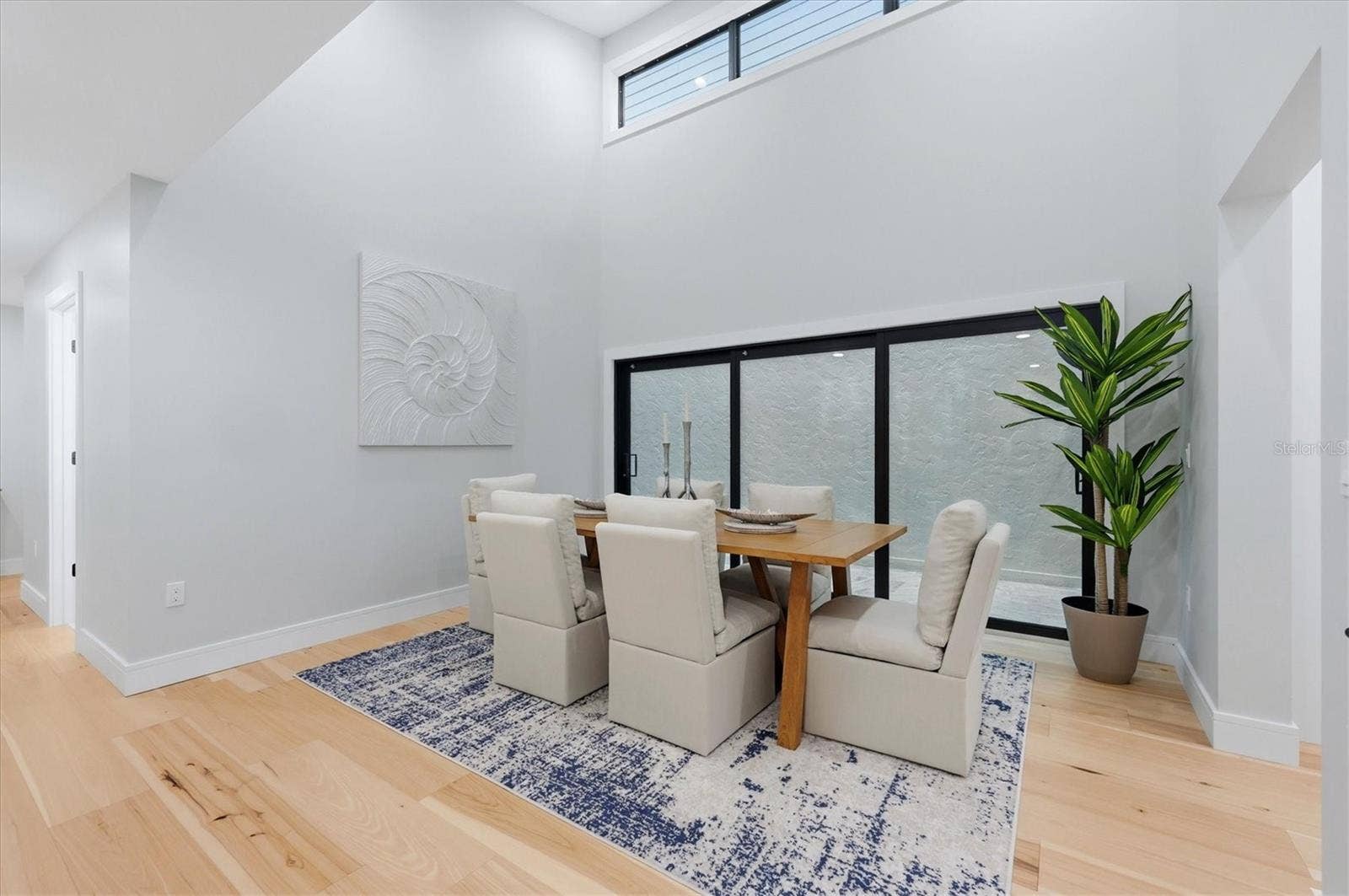 2141 HARBOURSIDE DRIVE, #1203, Longboat Key, FL 34228 Dining room adjacent to atrium