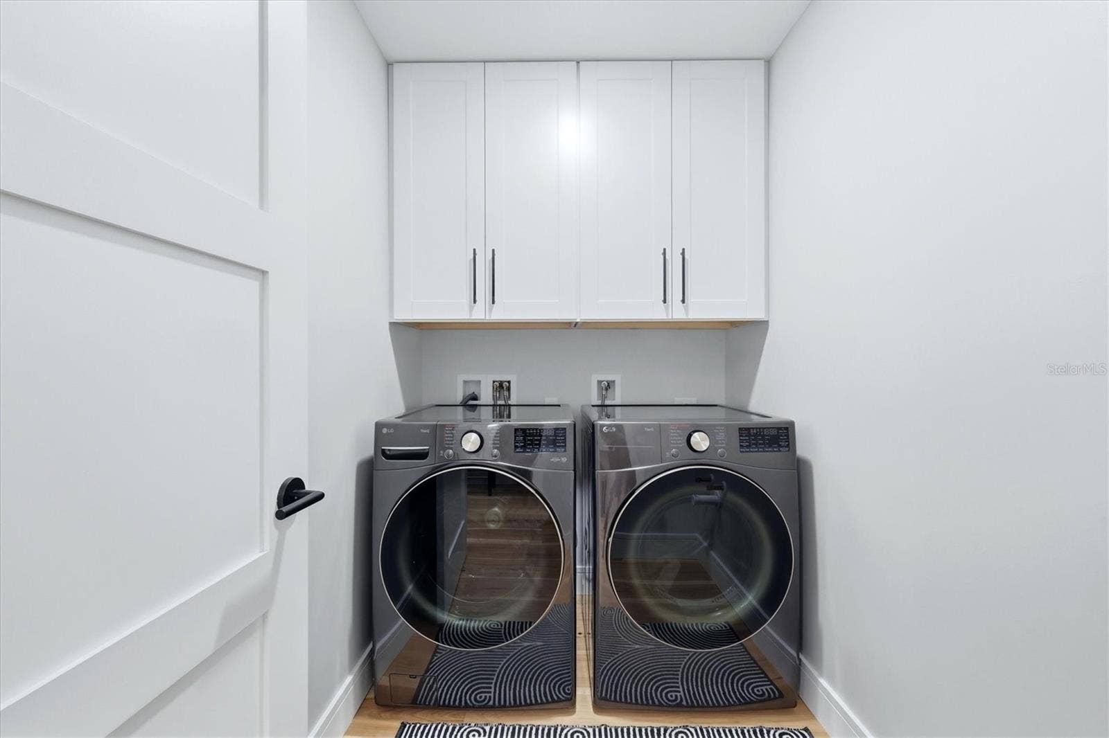 2141 HARBOURSIDE DRIVE, #1203, Longboat Key, FL 34228 Laundry Room with storage cabinets