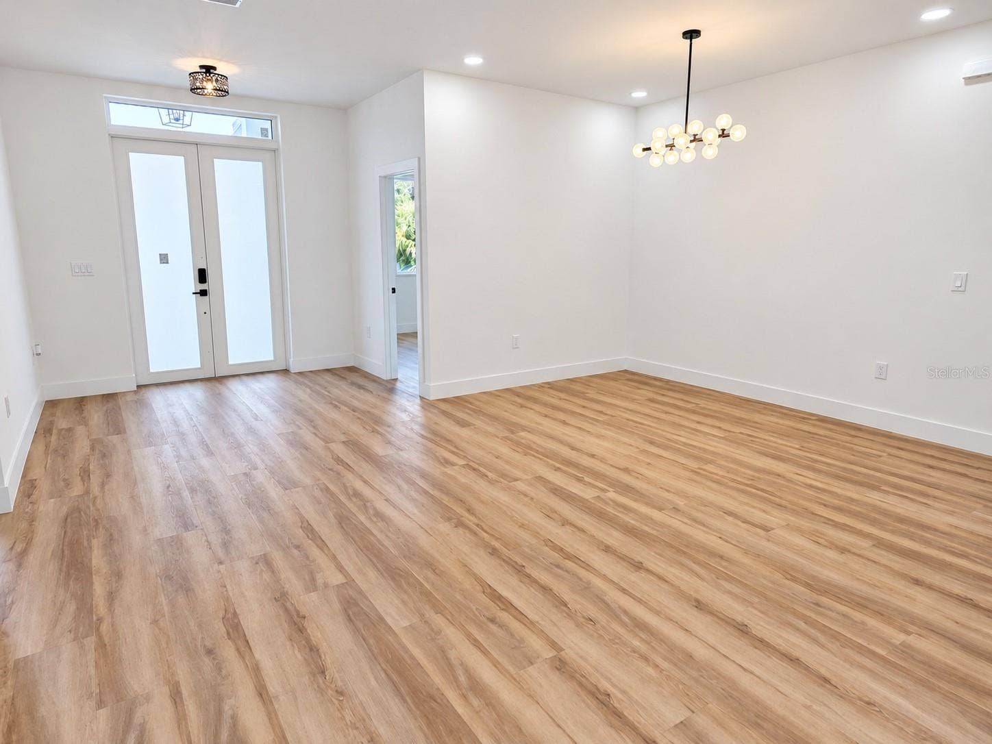 3126 BELLEVILLE TER, North Port, FL 34286 Unfurnished dining area with an open layout and contemporary lighting.
