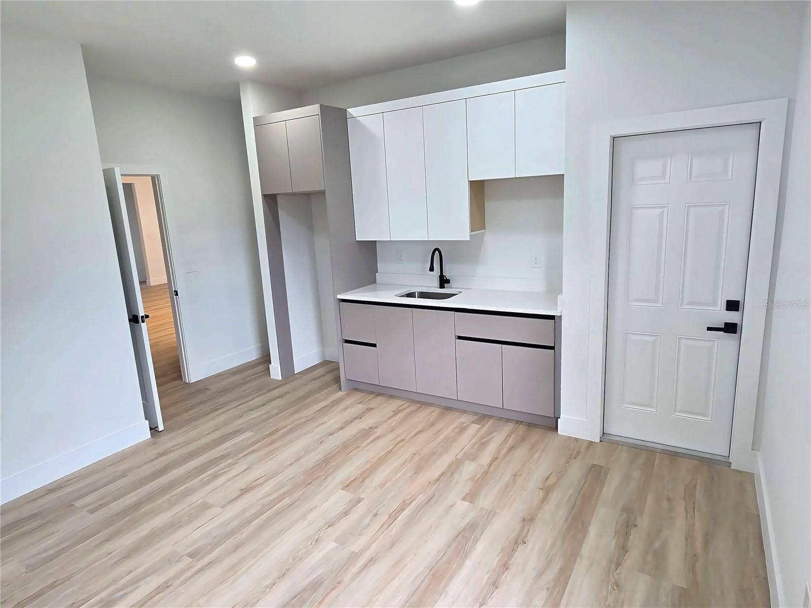 3126 BELLEVILLE TER, North Port, FL 34286 Alternate view of the in-law suite's kitchenette and living area.