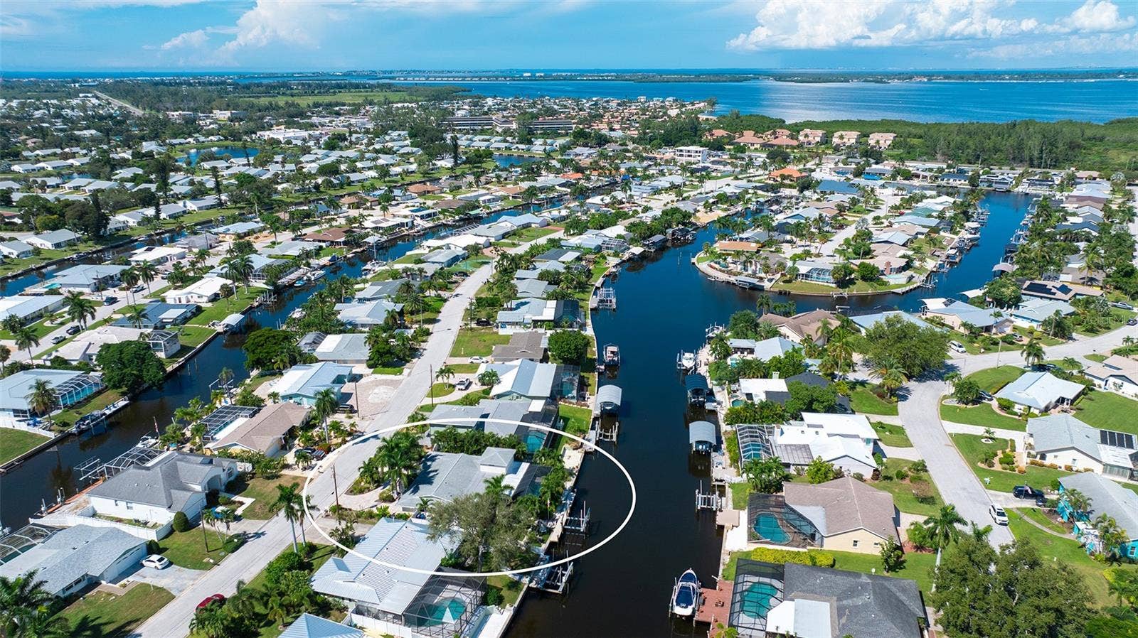 4907 CORAL BOULEVARD, Bradenton, FL 34210 An aerial view of the home within the Coral Shores waterways.