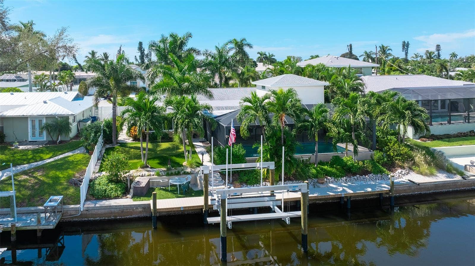 4907 CORAL BOULEVARD, Bradenton, FL 34210 Your saltwater waterfront retreat, with a pool, dock, golf and tropical landscaping.