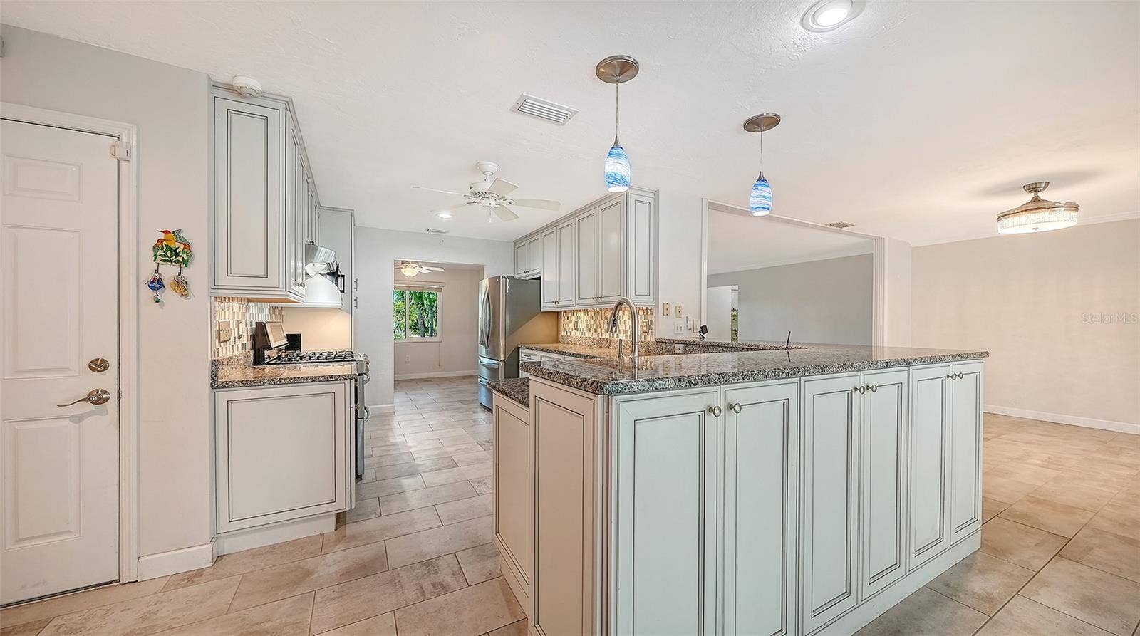 4907 CORAL BOULEVARD, Bradenton, FL 34210 A welcoming kitchen at the center of your gatherings.