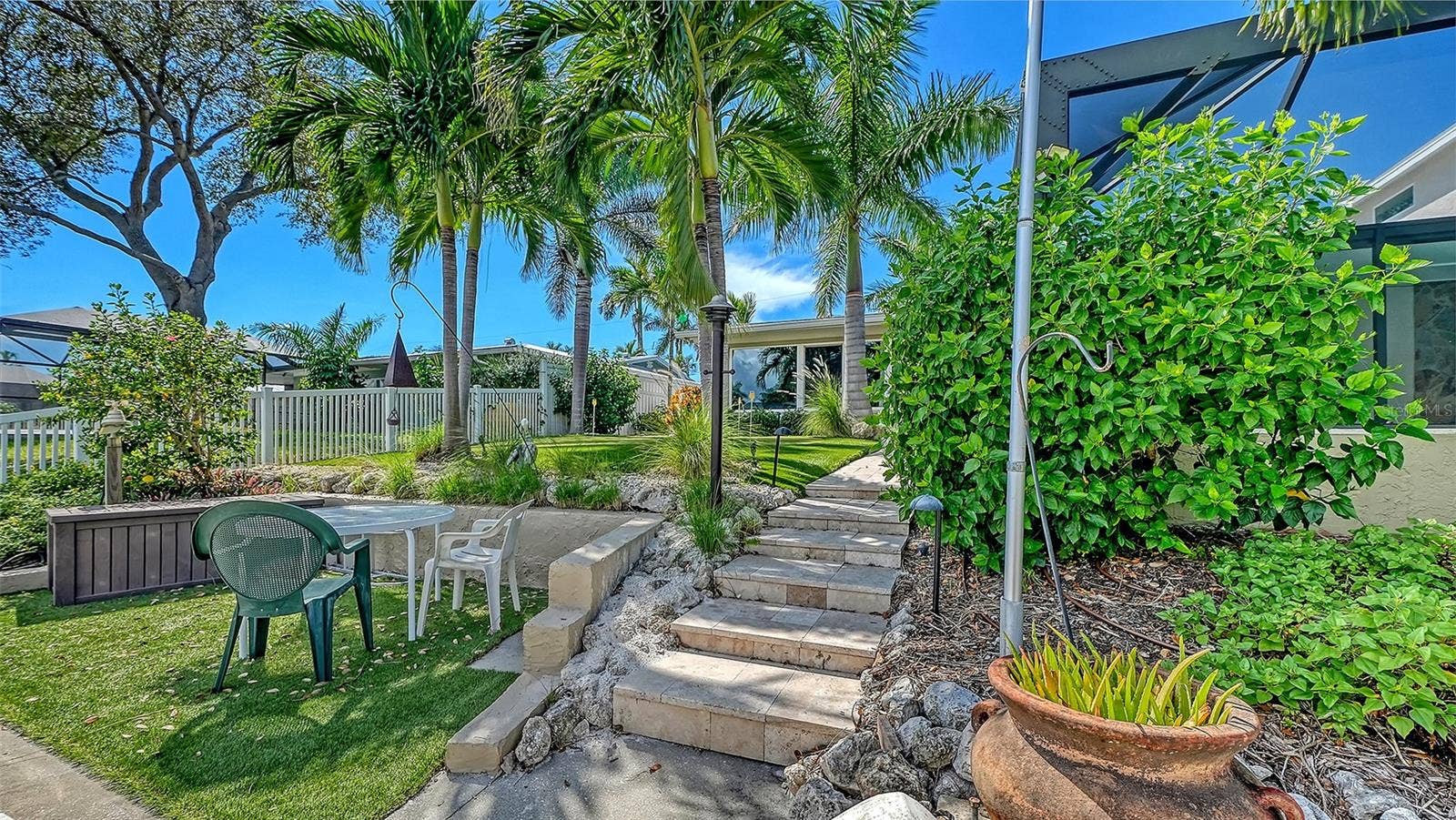 4907 CORAL BOULEVARD, Bradenton, FL 34210 Follow the garden steps from the waterfront to the backyard.