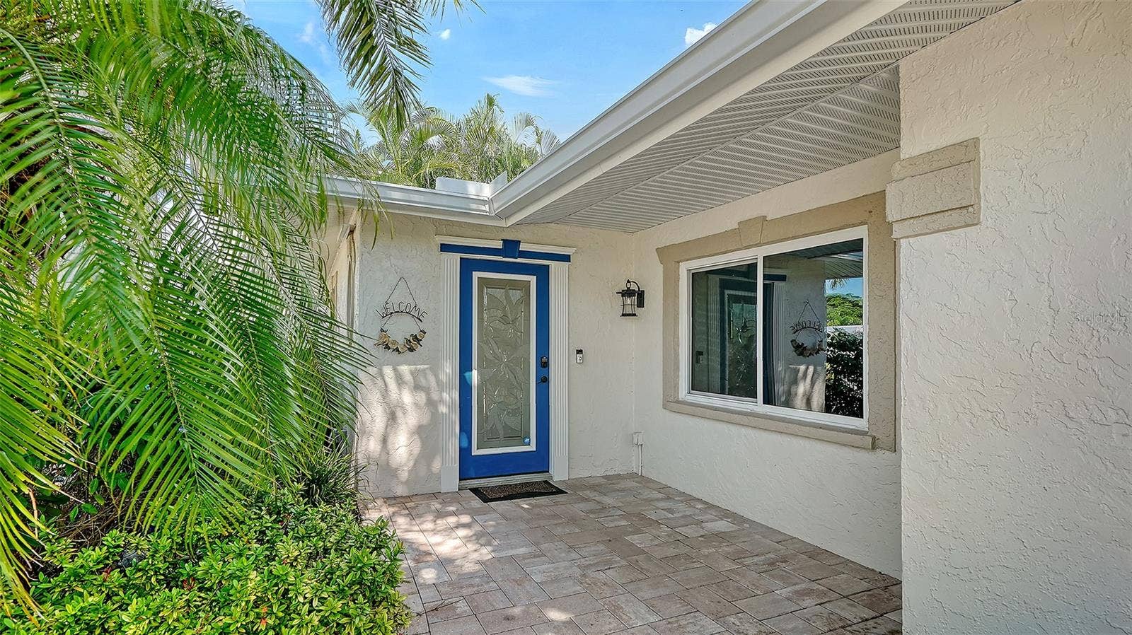 4907 CORAL BOULEVARD, Bradenton, FL 34210 A sheltered entry welcomes you home from a day on the water.