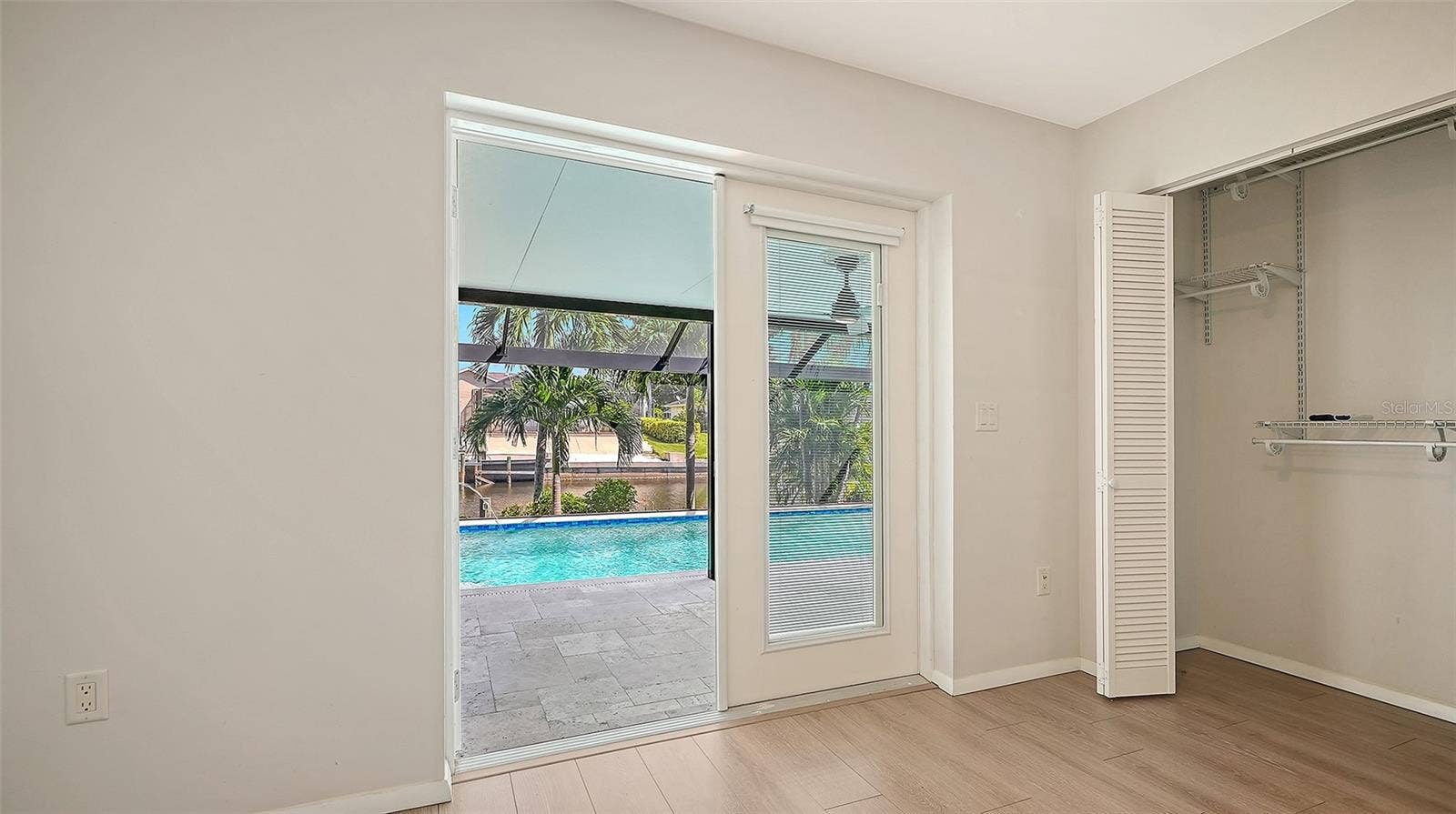 4907 CORAL BOULEVARD, Bradenton, FL 34210 Step toward the pool from this bright bedroom retreat.