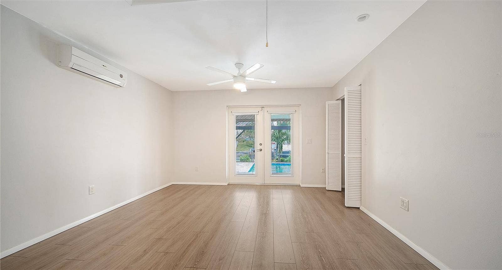 4907 CORAL BOULEVARD, Bradenton, FL 34210 French doors bring the poolside lifestyle close to your bedroom.