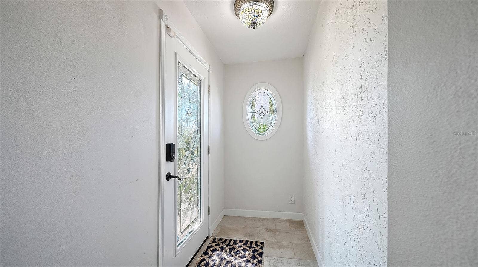 4907 CORAL BOULEVARD, Bradenton, FL 34210 A welcoming entry leads into the heart of the home.