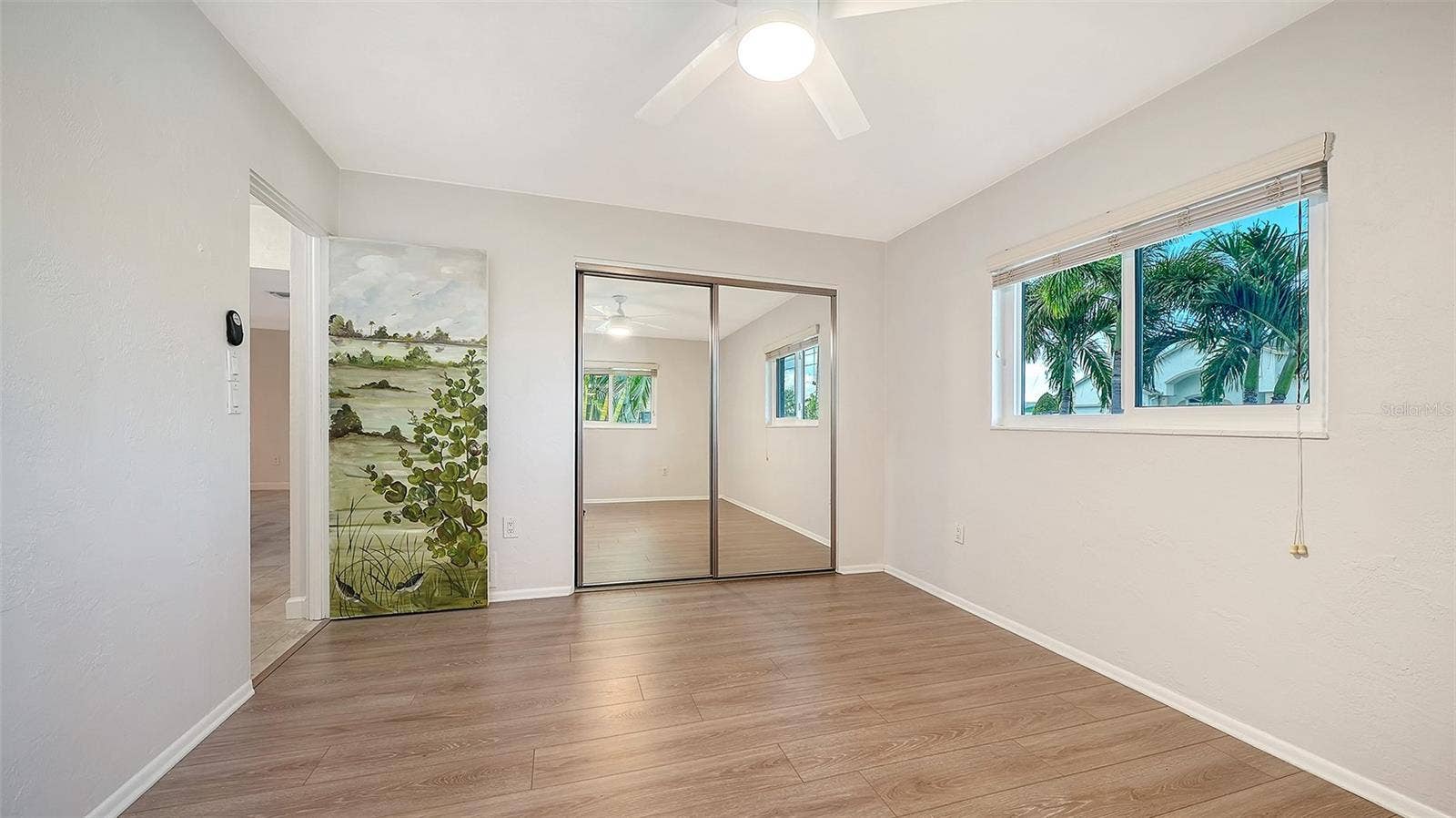 4907 CORAL BOULEVARD, Bradenton, FL 34210 Front Bedroom, comfortable guest retreat with an adjoining bathroom.