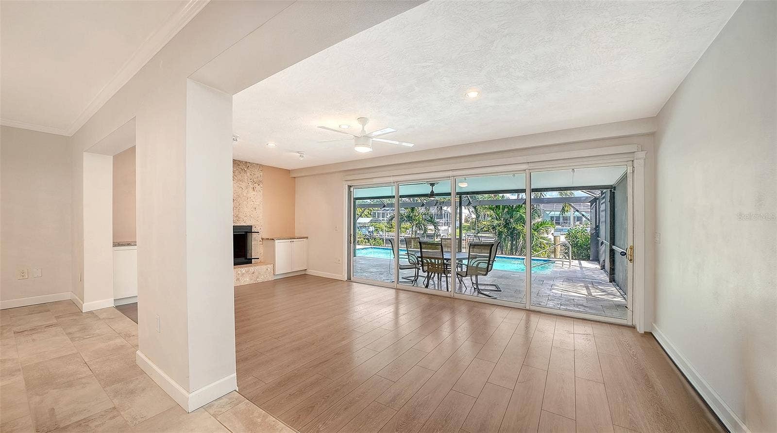 4907 CORAL BOULEVARD, Bradenton, FL 34210 Open the living space to shaded poolside dining.