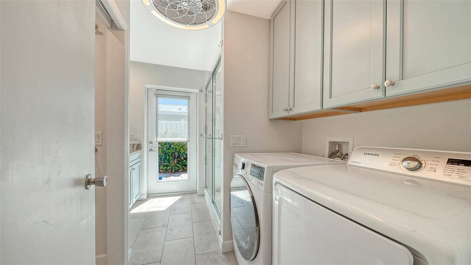 4907 CORAL BOULEVARD, Bradenton, FL 34210 A dedicated laundry area with overhead cabinetry.