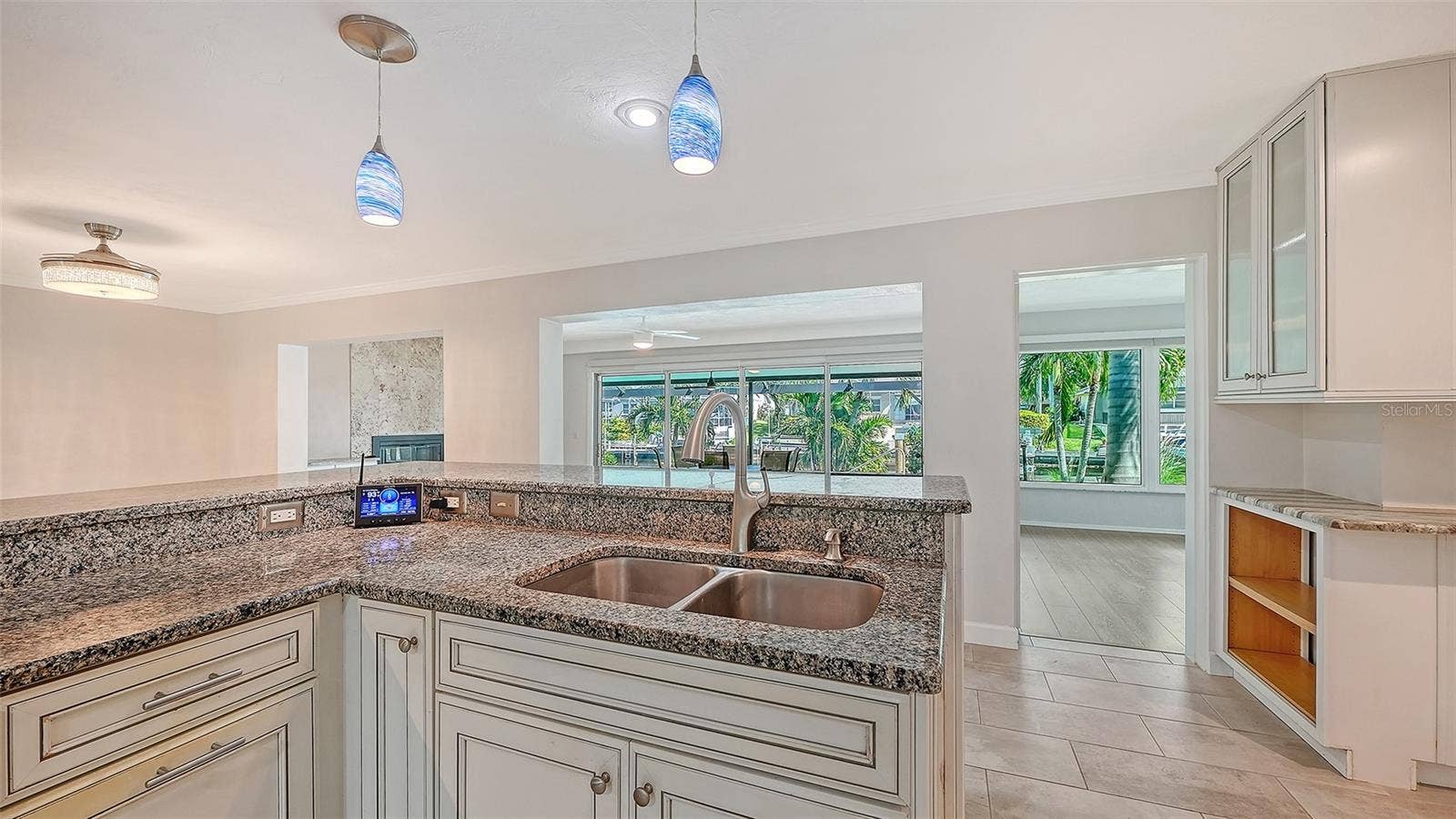4907 CORAL BOULEVARD, Bradenton, FL 34210 Prepare a meal while staying connected to the living areas.