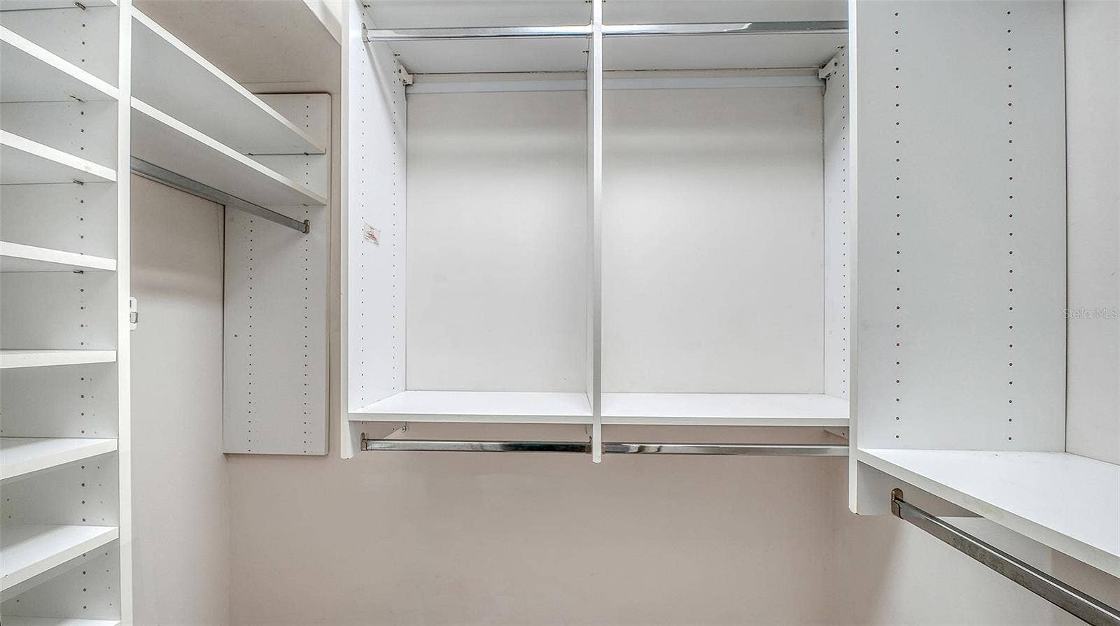 4907 CORAL BOULEVARD, Bradenton, FL 34210 Organized closet shelving keeps your wardrobe within reach.