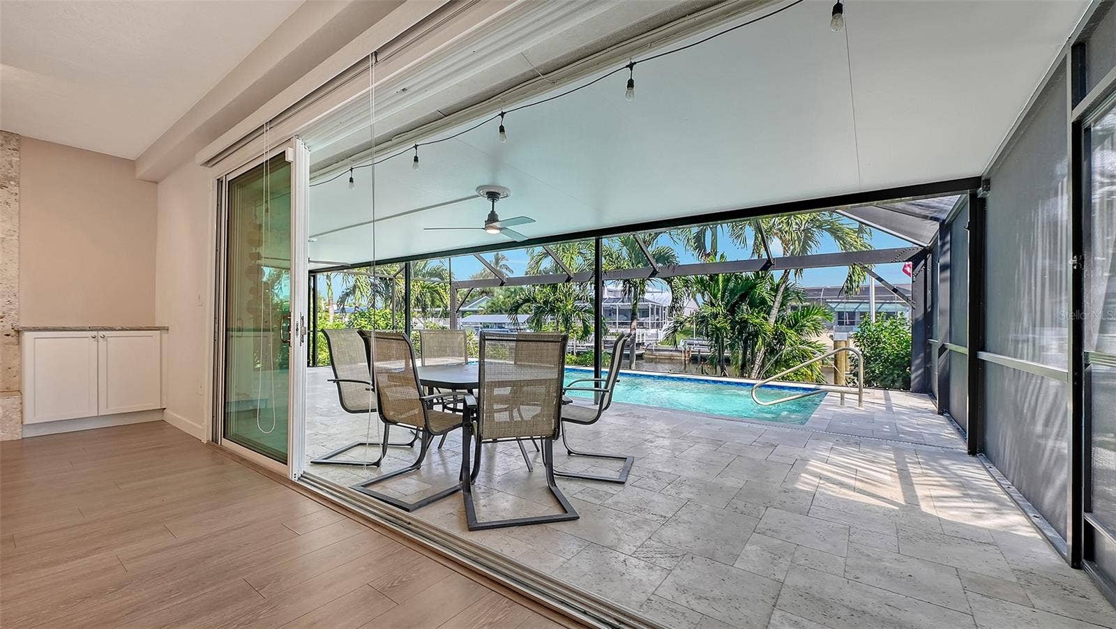 4907 CORAL BOULEVARD, Bradenton, FL 34210 Retractable sliding doors connect indoor comfort and outdoor relaxation.
