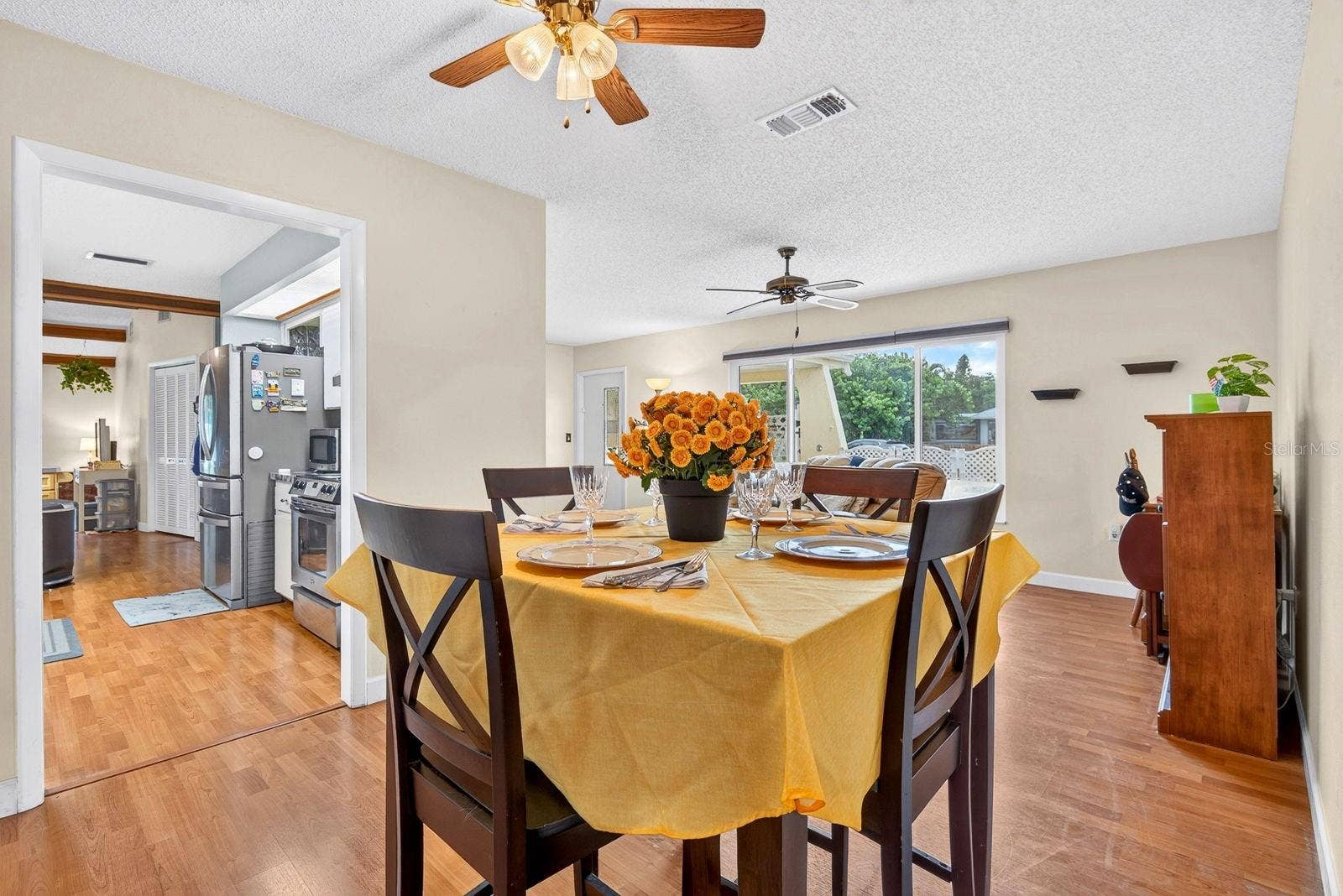 6806 21ST AVENUE TERRACE W, Bradenton, FL 34209 Dining area showing kitchen to the left and living room front window