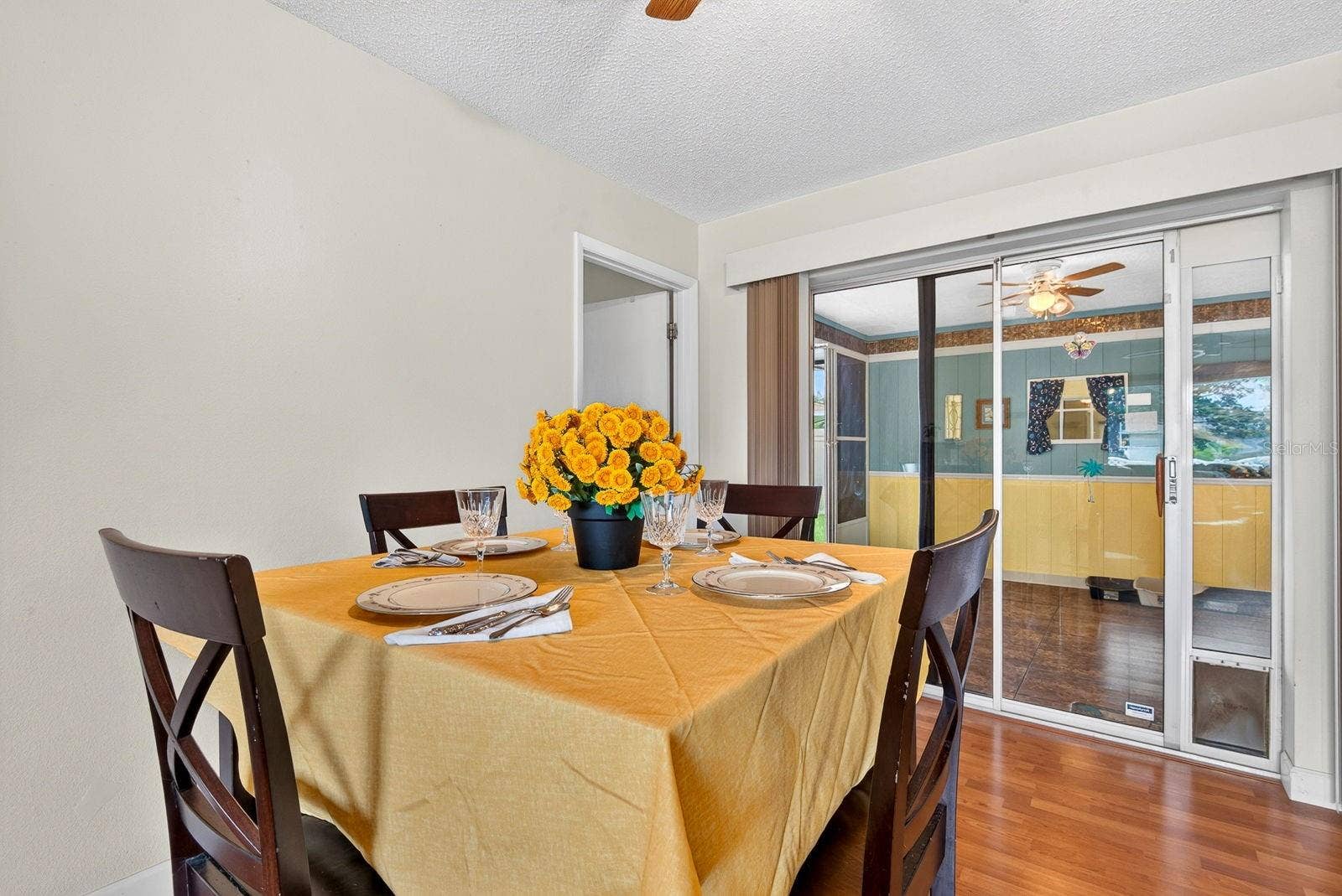 6806 21ST AVENUE TERRACE W, Bradenton, FL 34209 Dining area with enclosed lanai behind